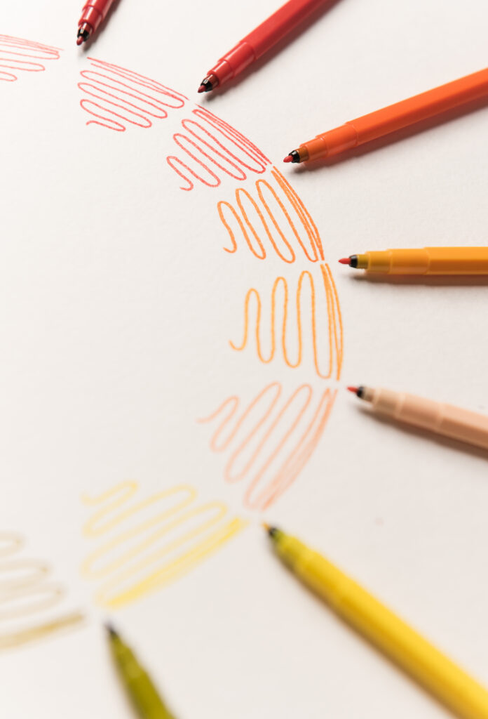 Circle with orange colorful markers making gradient